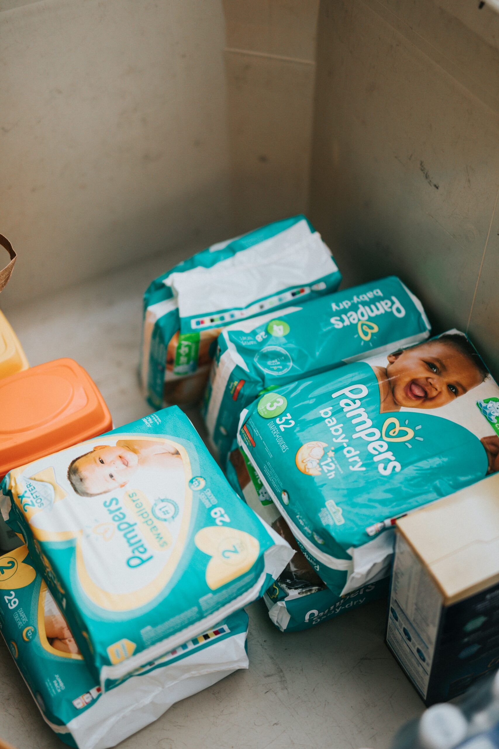 packages of diapers in a box